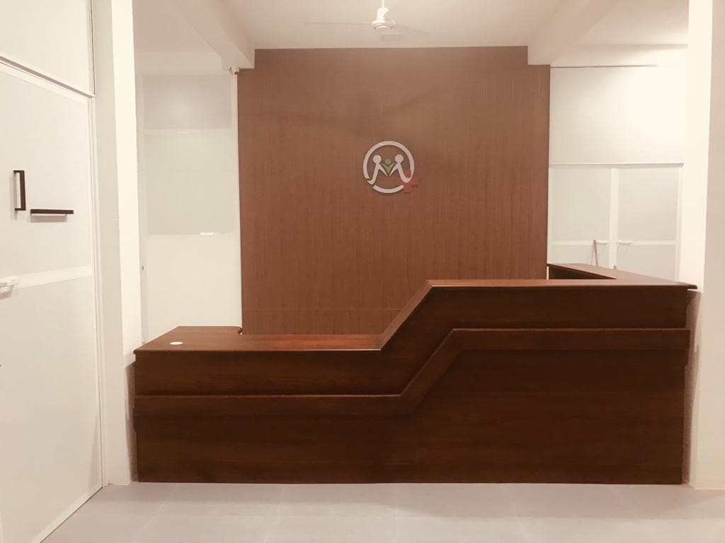 Custom reception counter and wood wall paneling by St Marys Enterprises